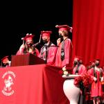Rachael Pitsch (left), Owen Rolph (center) and Abigail Moffett lead students in the turning of the tassels during graduation at Kenai Central High School on Monday, May 17 in Kenai, Alaska. (Ashlyn OHara/Peninsula Clarion)