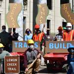 Supporters of the conservation corps programs established with CARES Act funding last year rallied in front of the Alaska State Capitol on Tuesday, May 18, 2021, to advocate for continued funding. (Peter Segall / Juneau Empire)