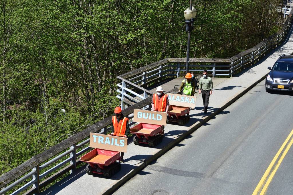 Track carriers used by trail builders to move gravel and dirt rumbled slowly down Calhoun Avenue on Tuesday, May 18, 2021, as supporters of conservation corps programs demonstrated from the Governors Mansion to the Alaska State Capitol. (Peter Segall / Juneau Empire)