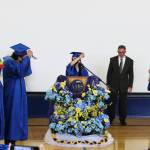 Brianna Mosiman (center) leads Kenai Alternative High School Graduates in turning their graduation cap tassels during Kenai Alternative High Schools 2021 graduation ceremony on Tuesday, May 18, 2021 in Kenai, Alaska. (Ashlyn OHara/Peninsula Clarion)