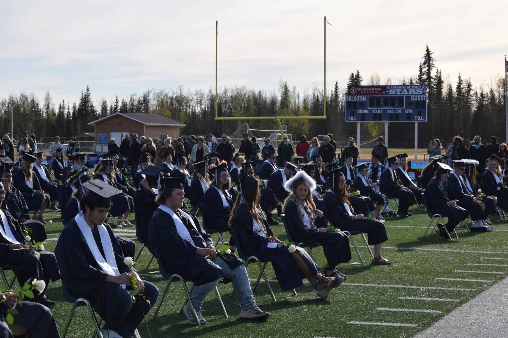 Soldotna High School students celebrate their graduation on Tuesday, May 18, 2021 at the high school football field. (Camille Botello / Peninsula Clarion)