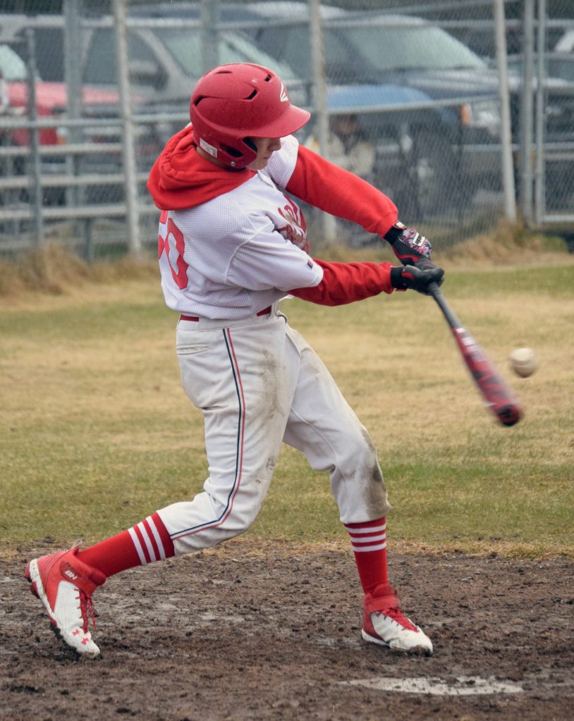 Kenai Centrals Owen Whicker hits against Soldotna on Wednesday, May 19, 2021, at the Kenai Little League fields in Kenai, Alaska. (Photo by Jeff Helminiak/Peninsula Clarion)