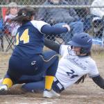 Soldotna's Lexi Stormo slides under the tag of Homer pitcher Zoe Adkins on Thursday, May 20, 2021, in Soldotna, Alaska. (Photo by Jeff Helminiak/Peninsula Clarion)