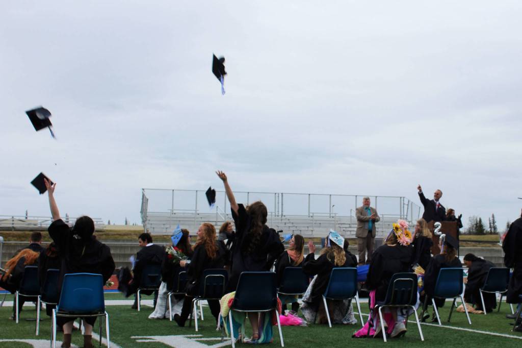 Graduates throw graduation caps at Connections Alaska Homeschool Programs 2021 graduation ceremony on Thursday, May 20, 2021 at Soldotna High School in Soldotna, Alaska. (Ashlyn OHara/Peninsula Clarion)