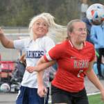 Homers Sela Weisser and Kenais Bethany Morris battle for the ball Friday, May 21, 2021, in the Peninsula Conference semifinals at Kenai Central High School in Kenai, Alaska. (Photo by Jeff Helminiak/Peninsula Clarion)
