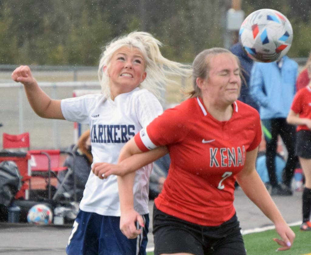 Homers Sela Weisser and Kenais Bethany Morris battle for the ball Friday, May 21, 2021, in the Peninsula Conference semifinals at Kenai Central High School in Kenai, Alaska. (Photo by Jeff Helminiak/Peninsula Clarion)