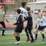 Homers Hunter Green flicks the ball on goal Friday, May 21, 2021, in the Peninsula Conference tournament at Kenai Central High School in Kenai, Alaska. (Photo by Jeff Helminiak/Peninsula Clarion)