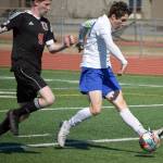Soldotnas Josh Hieber gets past Kenais Joe Hamilton to score Saturday, May 22, 2021, in the Peninsula Conference final at Kenai Central High School in Kenai, Alaska. (Photo by Jeff Helminiak/Peninsula Clarion)