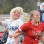 Homer's Sela Weisser and Kenai's Bethany Morris battle for the ball Friday, May 21, 2021, in the Peninsula Conference semifinals at Kenai Central High School in Kenai, Alaska. (Photo by Jeff Helminiak/Peninsula Clarion)