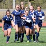 Soldotna congratulates Jolie Widaman (5) after she scored in the first half of the Peninsula Conference final Saturday, May 22, 2021, at Kenai Central High School in Kenai, Alaska. (Photo by Jeff Helminiak/Peninsula Clarion)