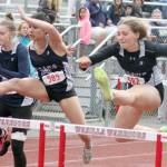 Soldotna’s Angelina Chavarria and Emma Brantley clear a hurdle during the Division I girls 100-meter hurdles in the Region 3 Championshps on Saturday, May 22, 2021, at Wasilla High School. (Photo by Jeremiah Bartz/Frontiersman)