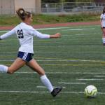 Soldotna defender Caleigh Glassmaker clears the ball from the defensive end at the Division II state championship game in Anchorage, Alaska, on Saturday, May 29, 2021. (Photo by Camille Botello/Peninsula Clarion)