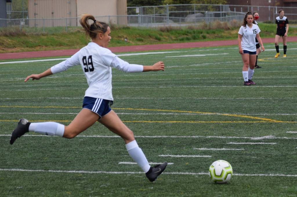 Soldotna defender Caleigh Glassmaker clears the ball from the defensive end at the Division II state championship game in Anchorage, Alaska, on Saturday, May 29, 2021. (Photo by Camille Botello/Peninsula Clarion)