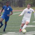 Soldotnas Maleda Denbrock runs to defend Thunder Mountains Logan Miller at the Division II state championship game in Anchorage, Alaska, on Saturday, May 29, 2021. (Photo by Camille Botello/Peninsula Clarion)