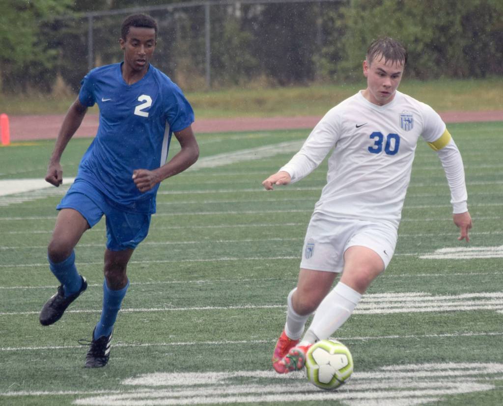 Soldotnas Maleda Denbrock runs to defend Thunder Mountains Logan Miller at the Division II state championship game in Anchorage, Alaska, on Saturday, May 29, 2021. (Photo by Camille Botello/Peninsula Clarion)