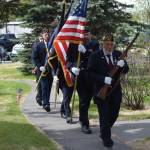 Honor Guard members proceed into the Memorial Day ceremony at Leif Hansen Memorial Park in Kenai, Alaska, on Monday, May 31, 2021. (Camille Botello/Peninsula Clarion)