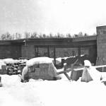 Work on the roof of the new hospital continues during the winter of 1966-67. At this point, the structure is little more than an empty shell built of concrete blocks. (Cheechako News file photo from KPCs Kenai Peninsula Historical Photo Repository)