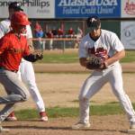 Peninsula Oilers first baseman Cole Hage forces out Marco Pirruccello of the Alaska Goldpanners of Fairbanks on Monday, June 7, 2021, at Coral Seymour Memorial Park in Kenai, Alaska. (Photo by Jeff Helminiak/Peninsula Clarion)