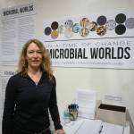 Mary Beth Leigh, director of the Microbial Worlds project, stands next to the exhibit on Friday, June 4, 2021, at the Pratt Museum & Park in Homer. The exhibit shows through the summer of 2021. (Photo by Michael Armstrong/Homer News)