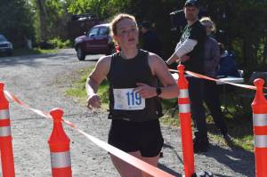 Aubrey Curl finishes first in the womens 5K race at the Kenai Watershed Forums Run for the River in Soldotna Creek Park on Saturday, June 12, 2021. (Camille Botello/Peninsula Clarion)