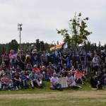 Participants in the Soldotna Pride March pose for a photograph in Soldotna Creek Park on Saturday, June 13, 2021 in Soldotna, Alaska. A group spanning the length of five blocks marched through downtown Soldotna to celebrate Pride Month. (Camille Botello/Peninsula Clarion)