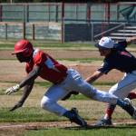 Jacob Belger tags an East Anchorage base runner out in a run-down for the final out of the game at Oiler Park on Sunday, June 13, 2021, securing the first league win for the Kenai Twins. (Camille Botello / Peninsula Clarion)