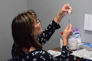 Nurse Tracy Silta draws a dose of the Moderna COVID-19 vaccine at the walk-in clinic at the intersection of the Kenai Spur and Sterling Highways in Soldotna, Alaska on Wednesday, June 9, 2021. (Camille Botello/Peninsula Clarion)