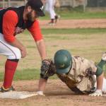 Mike Ferrara of the Mat-Su Miners dives safely back to first base in front of Oilers first baseman Bryce Marsh on Monday, June 21, 2021, at Coral Seymour Memorial Park in Kenai, Alaska. (Photo by Jeff Helminiak/Peninsula Clarion)