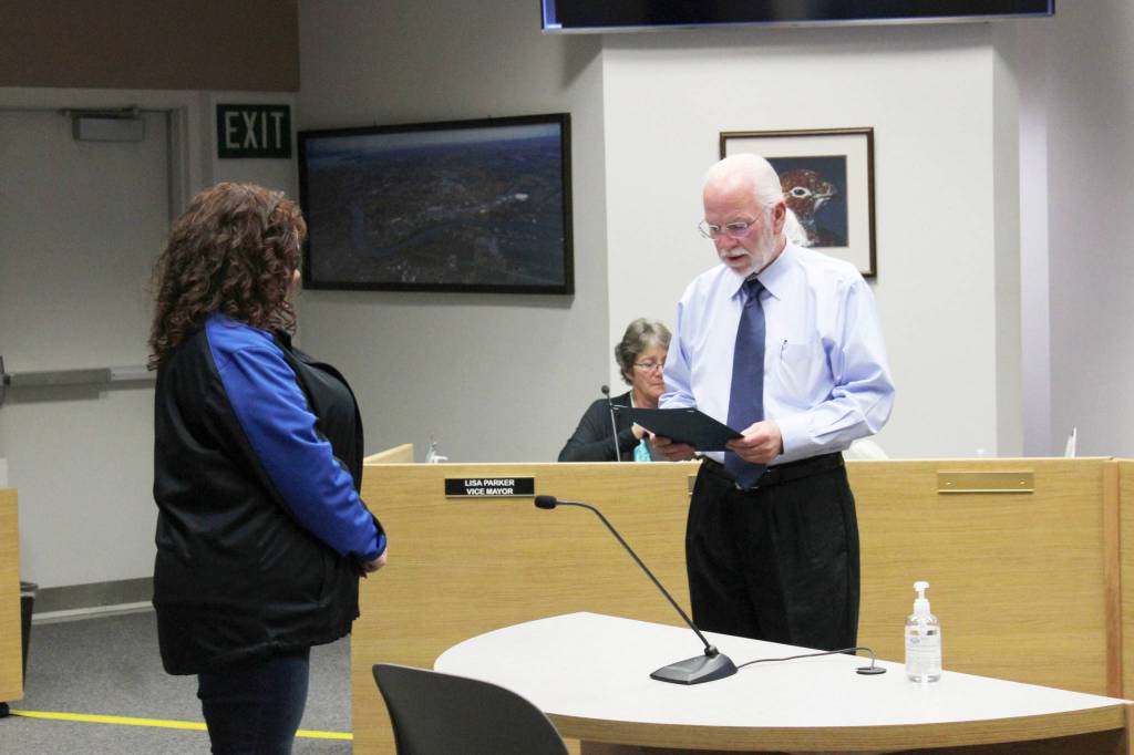 Soldotna Mayor Paul Whitney (right) presents Soldotna Chamber of Commerce Executive Director Shanon Davis with a proclamation on Wednesday, June 23, 2021 in Soldotna, Alaska. (Ashlyn OHara/Peninsula Clarion)
