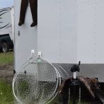 Dipnets lean against a trailer at Kasilof River State Recreational Site in Kasilof, Alaska, on Friday, June 25, 2021. The Kasilof River dipnet opening yields anglers from all over the state. (Camille Botello/Peninsula Clarion)