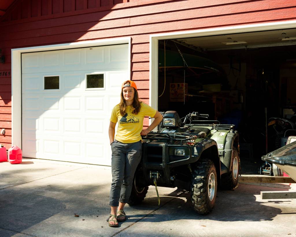 Seward High School student Annika Nilsson, 17, stands next to her familys all terrain vehicle, which is one of the only vehicles that can be used when her neighborhood roads flood every autumn. (Young Kim for The Hechinger Report)