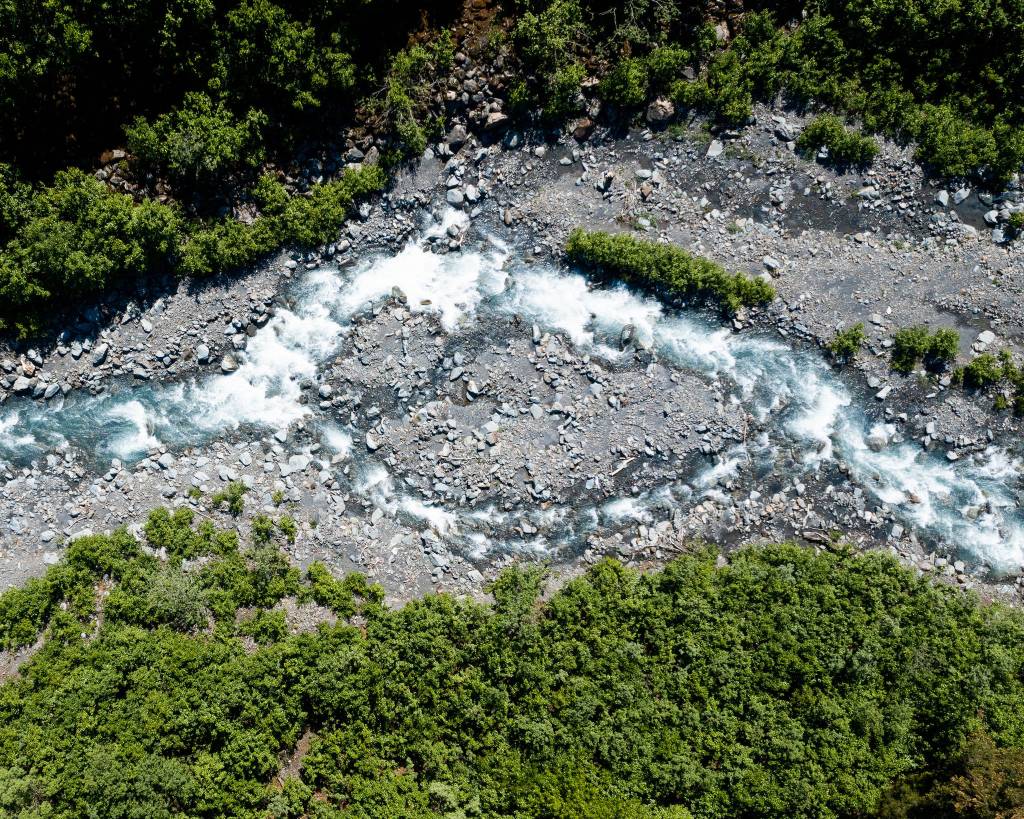 The Japanese Creek, pictured in June 2021, carries sediment, rocks and debris down from the mountains. The debris can move with violence and speed during surge flood events, threatening Seward, Alaska. (Young Kim for The Hechinger Report)