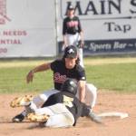 Peninsula Oilers shortstop Trevor Antonson tags out Garrett Ostrander of the Anchorage Bucs on a steal attempt Monday at Coral Seymour Memorial Park in Kenai. (Photo by Jeff Helminiak/Peninsula Clarion)