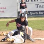 Peninsula Oilers shortstop Trevor Antonson tags out Garrett Ostrander of the Anchorage Bucs on a steal attempt Monday, June 28, 2021, at Coral Seymour Memorial Park in Kenai, Alaska. (Photo by Jeff Helminiak/Peninsula Clarion)