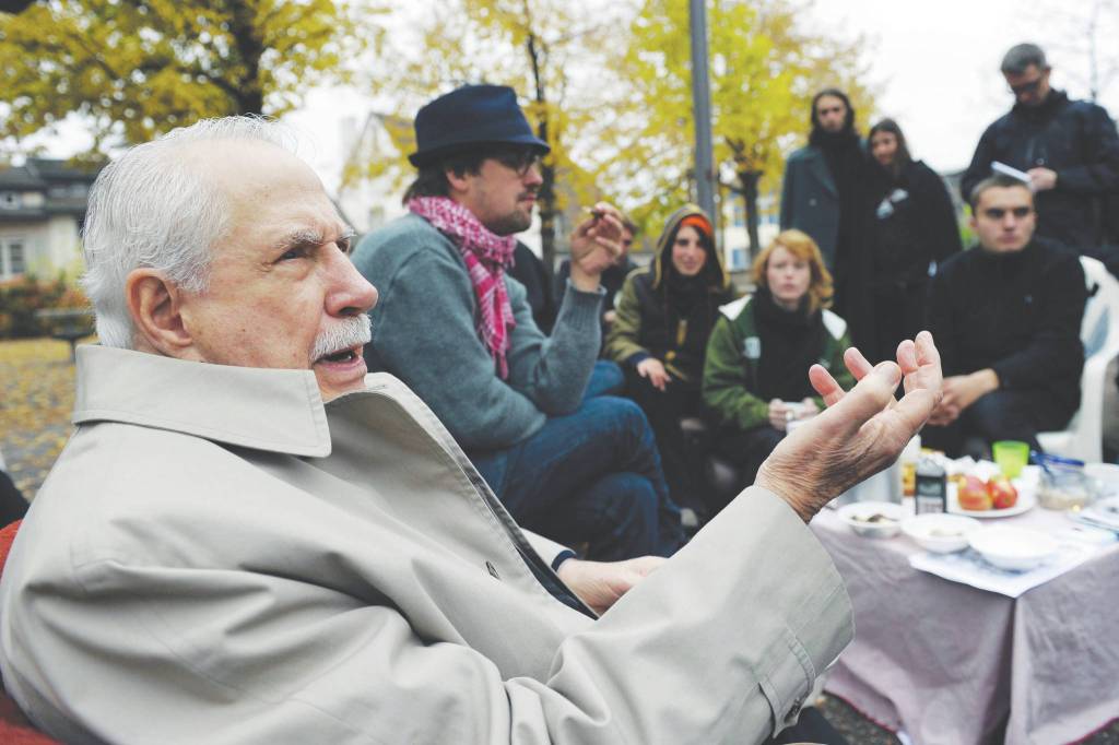 Former Democratic U.S. senator Mike Gravel gestures while talking to Occupy activists at Lindenhof square in Zurich, Switzerland, in this Monday, Oct. 31, 2011, file photo. Gravel, a former U.S. senator from Alaska who read the Pentagon Papers into the Congressional Record and confronted Barack Obama about nuclear weapons during a later presidential run, has died. He was 91. Gravel, who represented Alaska as a Democrat in the Senate from 1969 to 1981, died Saturday, June 26, 2021. Gravel had been living in Seaside, California, and was in failing health, said Theodore W. Johnson, a former aide. (AP Photo/Keystone, Steffen Schmidt, File)