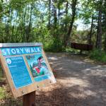 A podium marks the beginning of a StoryWalk at Soldotna Creek Park on Tuesday, June 29, 2021 in Soldotna, Alaska. (Ashlyn OHara/Peninsula Clarion)