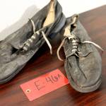 A pair of shoes recovered from the 1952 crash of a C-124 Globemaster were found this month on Colony Glacier and displayed at Joint Base Elmendorf-Richardson, Alaska, Tuesday, Sept. 29, 2021. (AP Photo/Mark Thiessen)