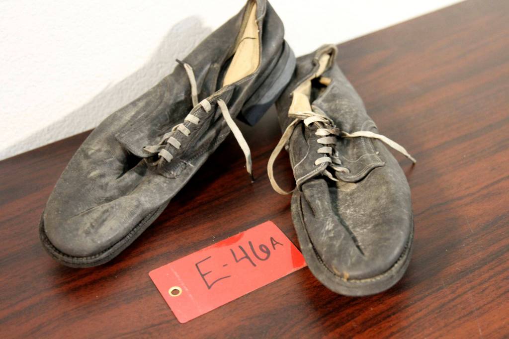A pair of shoes recovered from the 1952 crash of a C-124 Globemaster were found this month on Colony Glacier and displayed at Joint Base Elmendorf-Richardson, Alaska, Tuesday, Sept. 29, 2021. (AP Photo/Mark Thiessen)