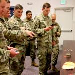 Alaska-based military members who participated in a search for human remains and personal items from the 1952 crash of a C-124 Globemaster view some of the items that were found, Tuesday, Sept. 29, 2021, at Joint Base Elmendorf-Richardson, Alaska. (AP Photo/Mark Thiessen)