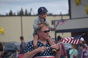 Community members affiliated with local organizations participate in Kenais annual Fourth of July parade on July 4, 2021. (Camille Botello / Peninsula Clarion)