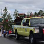 Smokey the Bear waves to the crowd during Kenais annual Independence Day parade on July 4, 2021. (Camille Botello / Peninsula Clarion)