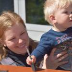 Carol and Fynn Bryant participatesin the Kenai National Wildlife Refuges Fish Week at the visitor center on July 6, 2021. (Camille Botello / Peninsula Clarion)