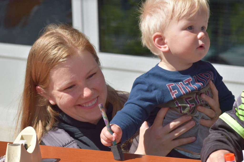 Carol and Fynn Bryant participatesin the Kenai National Wildlife Refuges Fish Week at the visitor center on July 6, 2021. (Camille Botello / Peninsula Clarion)