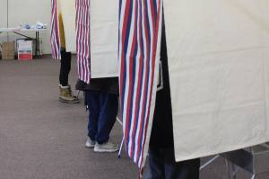 Voters fill out ballots in voting booths at the Soldotna Regional Sports Complex on Tuesday, Nov. 3, 2020, in Soldotna, Alaska. (Photo by Ashlyn OHara/Peninsula Clarion)