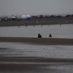 Fishers dipnet in the mouth of the Kenai River on Saturday, July 10, 2021. (Camille Botello / Peninsula Clarion)