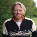 Homer City Council candidate Joey Evensen poses for a photo on Sept. 6, 2019, by Beluga Slough at his Homer, Alaska, home. (Photo by Michael Armstrong/Homer News)