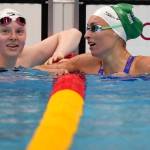 Lydia Jacoby, left, of the United States congratulates Tatjana Schoenmaker of South Africa after their heat in the womens 100-meter breaststroke at the 2020 Summer Olympics, Sunday, July 25, 2021, in Tokyo, Japan. (AP Photo/Matthias Schrader)