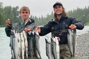 Daniel Balserak and Luke Konson fish for salmon in Alaska. The pair has been traveling the country and catching every official state fish for the past 11 months. (Photo provided)