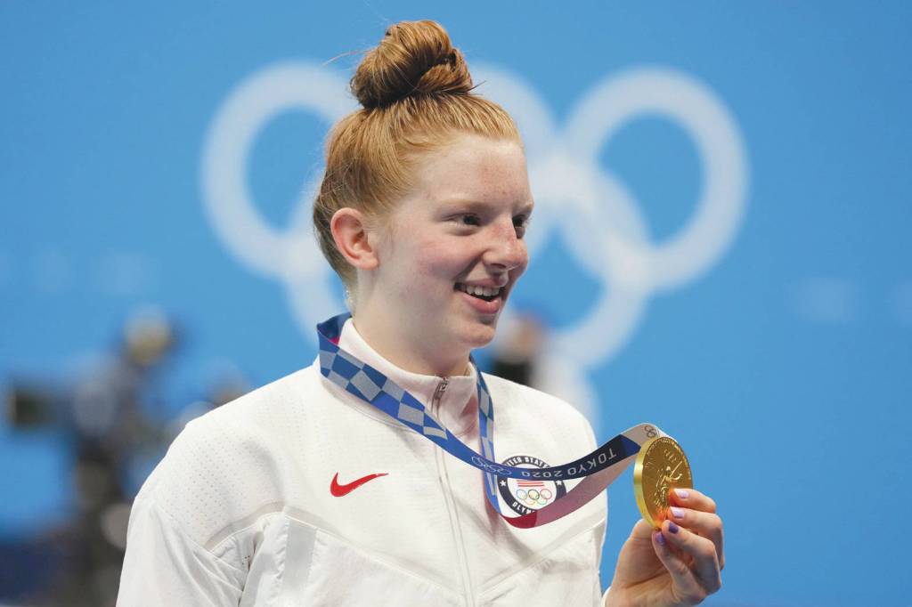 Lydia Jacoby, of the United States, poses with the gold medal after winning the final of the womens 100-meter breaststroke at the 2020 Summer Olympics, Tuesday, July 27, 2021, in Tokyo, Japan. (AP Photo/Petr David Josek)