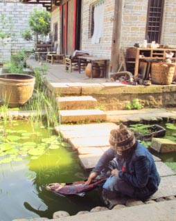 Kathy Matta polishes her lacquer fish in China in this undated photo. (Photo provided by Kathy Matta)